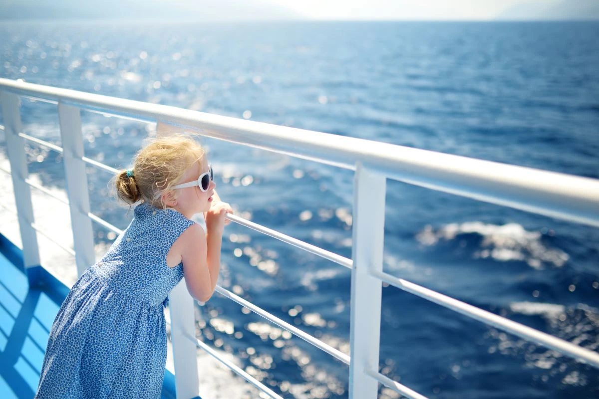 A girl enjoying a ferry ride while traveling in Greece